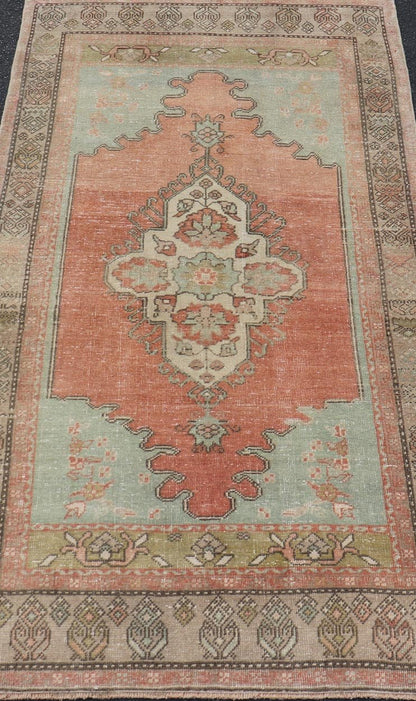 Vintage Turkish Oushak Rug With Medallion in Earthy Color Tones With Coral Color. Keivan Woven Arts / rug EN - 14597, country of origin / type: Turkey / Oushak, circa 1940 Measures: 3'2 x 5'11 This vintage Oushak carpet from Turkey has center m... - Keivan Woven ArtsEN - 14597 - 23768Rug
