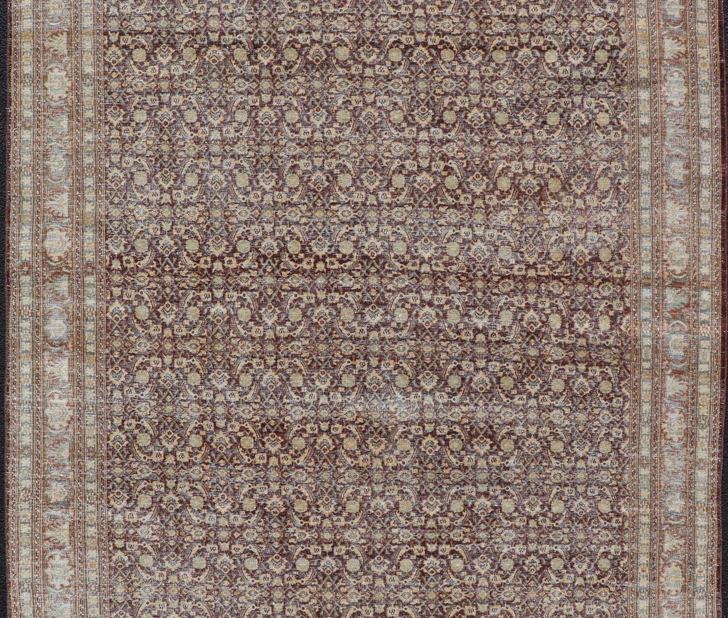 Measures: 6'4 x 9'10 Persian Tabriz Antique Rug in Herati Design In Dark Arginine, Blue, and Tan. Keivan Woven Arts / rug EN - 14794, country of origin / type: Iran / Tabriz, circa 1920. This beautiful early 20th century Persian Tabriz rug has... - Keivan Woven ArtsEN - 14794 - 21853