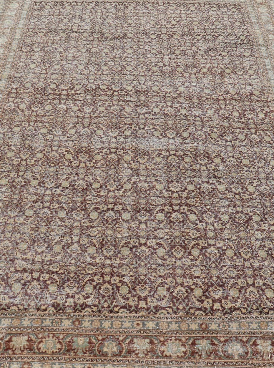 Measures: 6'4 x 9'10 Persian Tabriz Antique Rug in Herati Design In Dark Arginine, Blue, and Tan. Keivan Woven Arts / rug EN - 14794, country of origin / type: Iran / Tabriz, circa 1920. This beautiful early 20th century Persian Tabriz rug has... - Keivan Woven ArtsEN - 14794 - 21853