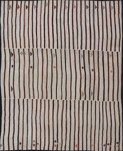 Measures: 14'8 x 18'6 This flat - weave tribal Turkish kilim has been hand - woven in wool. The rug features an all - over sub - geometric striped panel design, rendered in earthy tones; making this rug a superb fit for a wide variety of interiors. ... - Keivan Woven ArtsEN - 14854 - 22812Rug