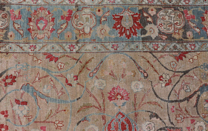 Antique Persian Tabriz Rug with Floral Medallion Design in Tan, Red, and Blue. Keivan Woven Arts / rug EN - 14861, country of origin / type: Iran / Tabriz, circa 1920 Floral Medallion Design in Tan, Red, and Blue. Measures: 8'4 x 11'9 This sublim... - Keivan Woven ArtsEN - 14861 - 23492Rug