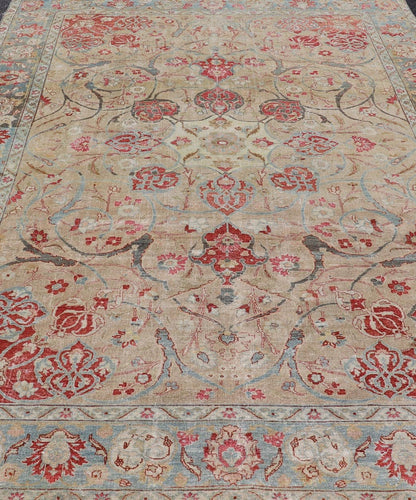 Antique Persian Tabriz Rug with Floral Medallion Design in Tan, Red, and Blue. Keivan Woven Arts / rug EN - 14861, country of origin / type: Iran / Tabriz, circa 1920 Floral Medallion Design in Tan, Red, and Blue. Measures: 8'4 x 11'9 This sublim... - Keivan Woven ArtsEN - 14861 - 23492Rug