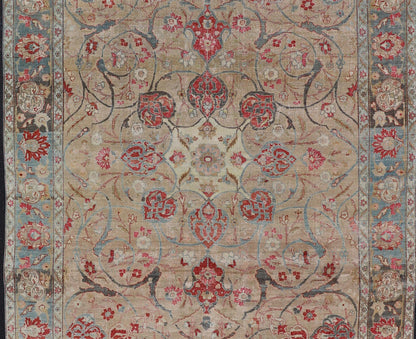 Antique Persian Tabriz Rug with Floral Medallion Design in Tan, Red, and Blue. Keivan Woven Arts / rug EN - 14861, country of origin / type: Iran / Tabriz, circa 1920 Floral Medallion Design in Tan, Red, and Blue. Measures: 8'4 x 11'9 This sublim... - Keivan Woven ArtsEN - 14861 - 23492Rug