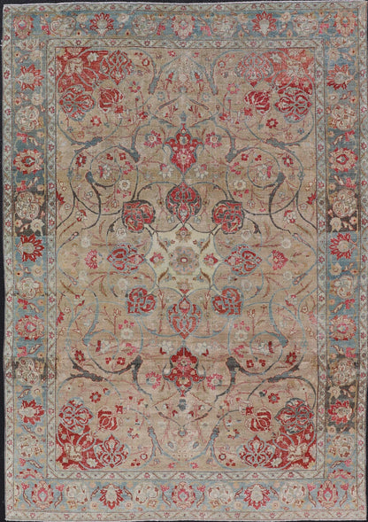 Antique Persian Tabriz Rug with Floral Medallion Design in Tan, Red, and Blue. Keivan Woven Arts / rug EN - 14861, country of origin / type: Iran / Tabriz, circa 1920 Floral Medallion Design in Tan, Red, and Blue. Measures: 8'4 x 11'9 This sublim... - Keivan Woven ArtsEN - 14861 - 23492Rug