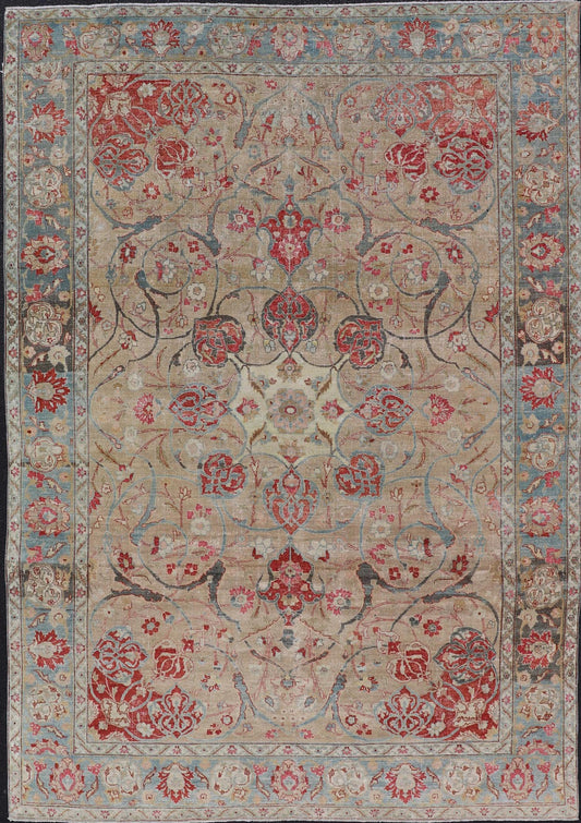 Antique Persian Tabriz Rug with Floral Medallion Design in Tan, Red, and Blue. Keivan Woven Arts / rug EN - 14861, country of origin / type: Iran / Tabriz, circa 1920 Floral Medallion Design in Tan, Red, and Blue. Measures: 8'4 x 11'9 This sublim... - Keivan Woven ArtsEN - 14861 - 23492