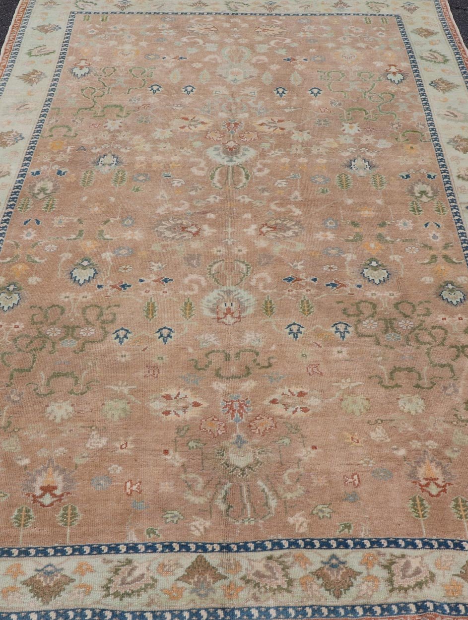 Colorful Turkish Oushak Rug in Salmon Background with All - Over Floral Design. Country of Origin: Turkey; Type: Oushak; Design: All - Over, Floral; Keivan Woven Arts/ rug EN - 14950; Measures: 6'7 x 10'7 Beautiful 1930's colorful Turkish Oush... - Keivan Woven ArtsEN - 14950 - 23666Rug