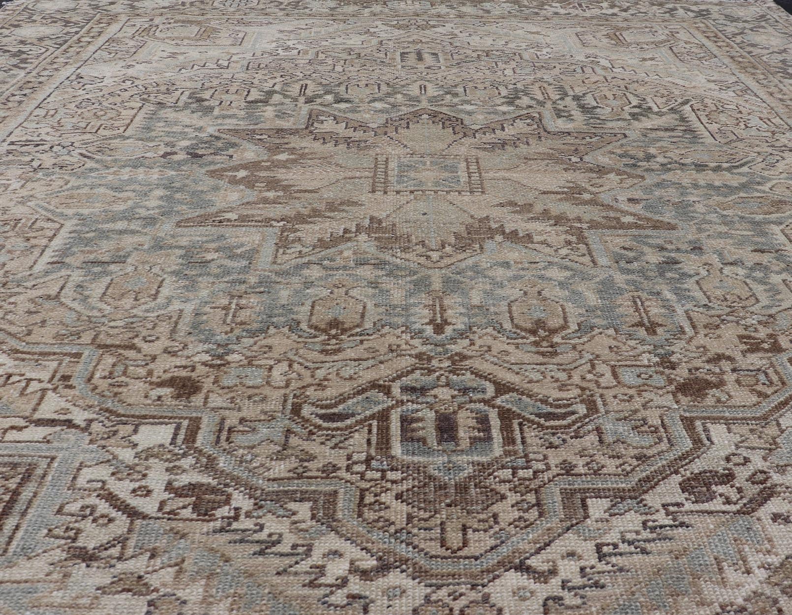 Square Antique Heriz Rug with Geometric Design in Blue's, Tan, Cream, and Brown. Keivan Woven Arts / rug EN - 15000, country of origin / type: Iran / Heriz, circa 1930 Measures: 7'6 x 8'5 This square Persian Heriz carpet bears an exqui... - Keivan Woven ArtsEN - 15000 - 23672