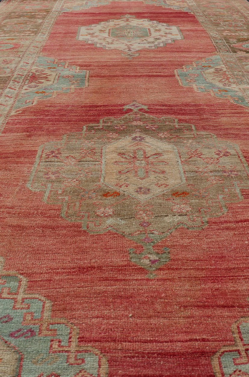 Measures: 5'4 x 11'6 Turkish Vintage Oushak Gallery with Tribal Medallions in Coral, Lt. Green & Tan. Country of origin: Turkey; Type: Oushak; Design: Tribal, Tribal Medallion; Keivan Woven Arts: rug EN - 15116. This vintage Turkish Oushak fe... - Keivan Woven ArtsEN - 15116 - 22848Rug
