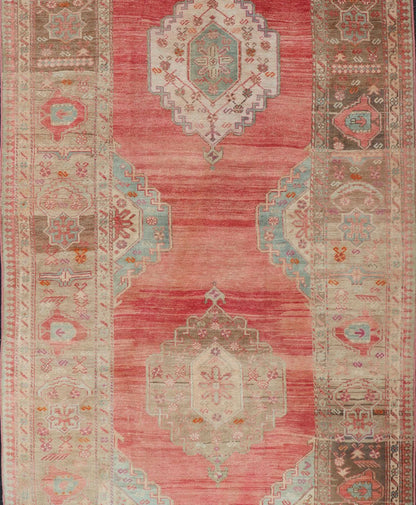 Measures: 5'4 x 11'6 Turkish Vintage Oushak Gallery with Tribal Medallions in Coral, Lt. Green & Tan. Country of origin: Turkey; Type: Oushak; Design: Tribal, Tribal Medallion; Keivan Woven Arts: rug EN - 15116. This vintage Turkish Oushak fe... - Keivan Woven ArtsEN - 15116 - 22848Rug