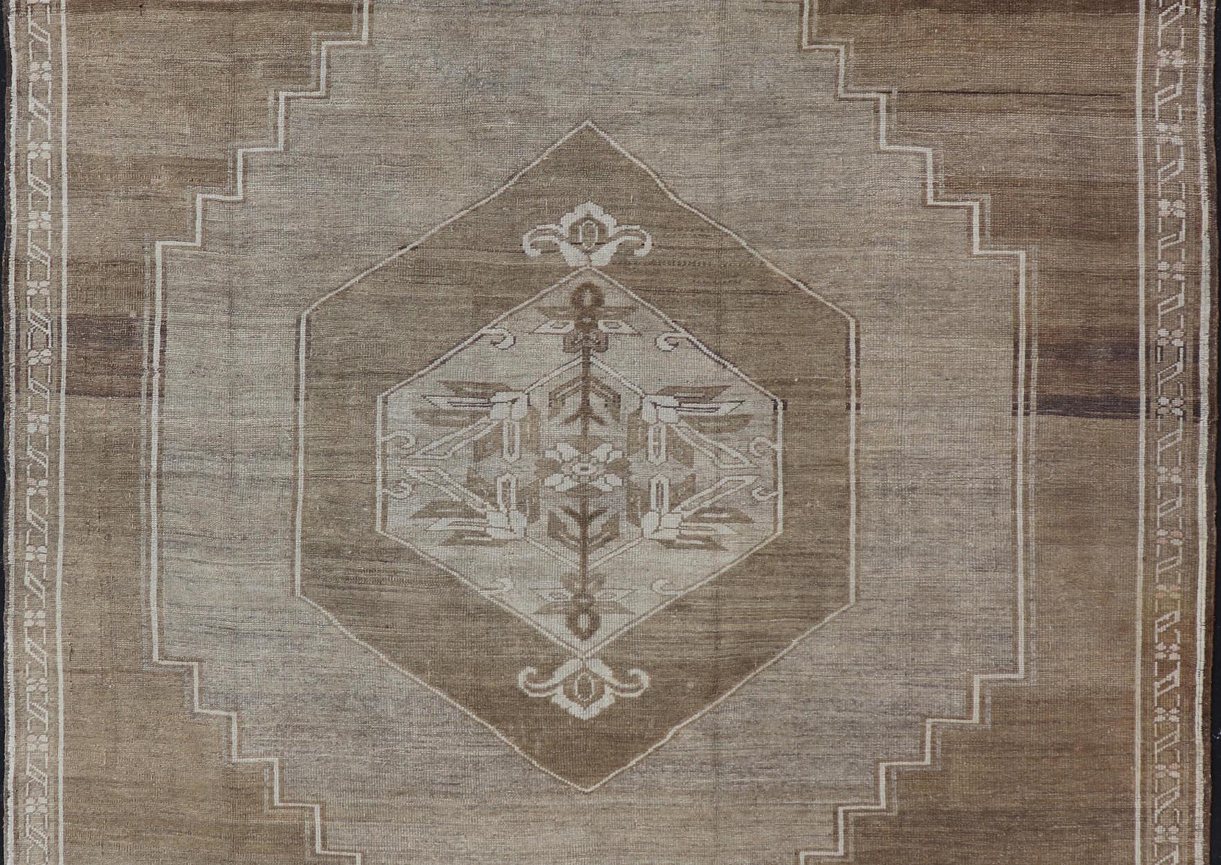 Measures: 9'2 x 10'9 Turkish Vintage Kars Rug in Brown Background With Gray and Hints of Green. Keivan Woven Arts / rug EN - 15156, country of origin / type: Turkey / Oushak, circa mid - 20th century This vintage Turkish rug, (circa mid - 20th ce... - Keivan Woven ArtsEN - 15156 - 22410Rug