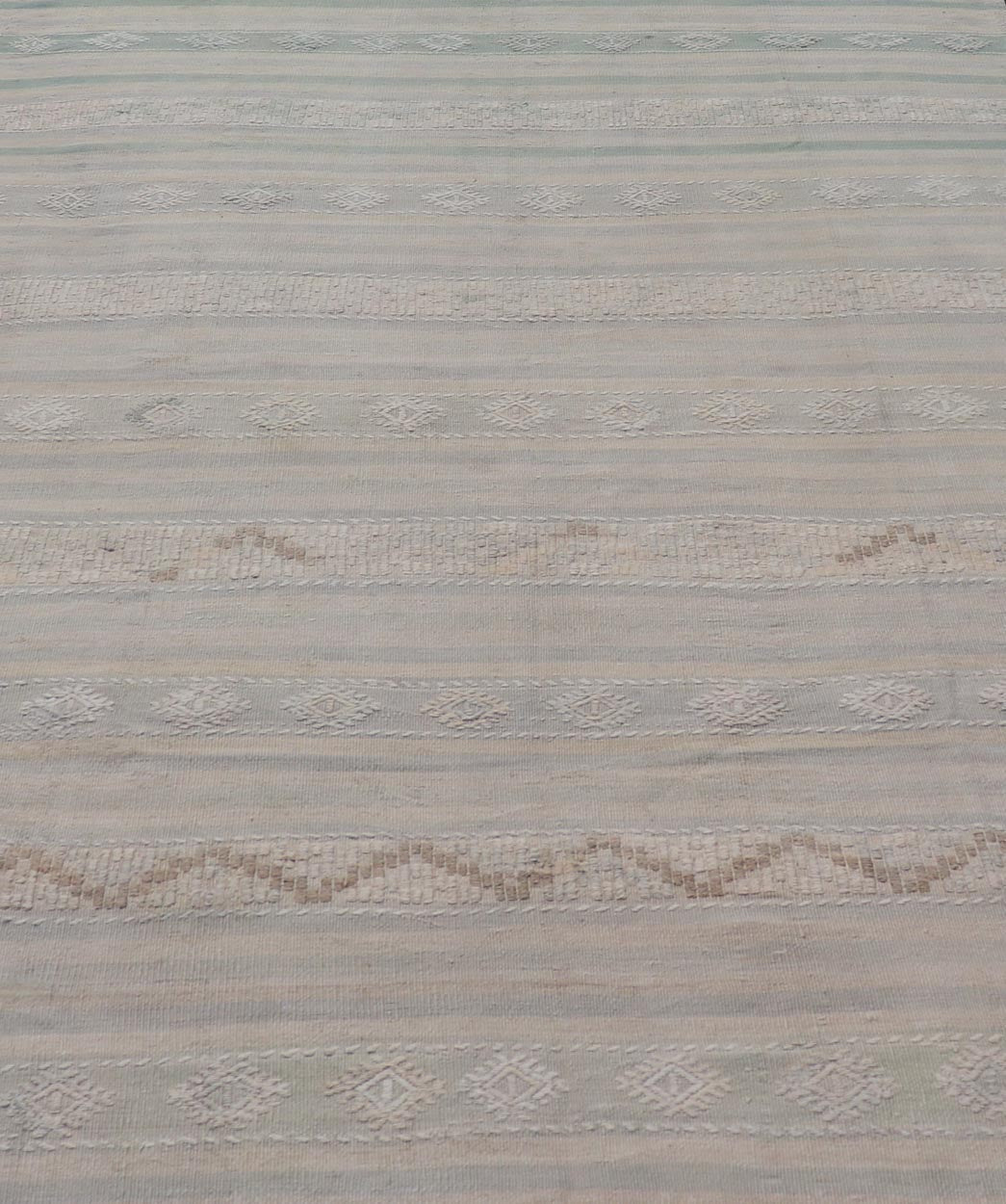 Measures: 6'6 x 10'0 Turkish Flat - Weave in Tan, Taupe, and Gray - Blue with Stripes and Embroideries. Keivan Woven Arts / Rug EN - 15176, country of origin / type: Turkey / Kilim, circa 1950. This vintage Turkish Kilim rug features a contemporar... - Keivan Woven ArtsEN - 15176 - 21877Rug