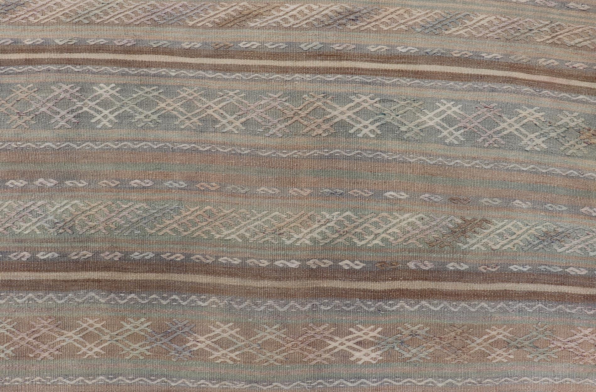 Vintage Turkish Flat - Weave Kilim with Embroideries in Muted Tones and Stripes. Keivan Woven Arts / rug EN - 15180, country of origin / type: Turkey / Kilim, circa 1950 Measures: 5'2 x 8'3 This vintage Turkish Kilim rug features a contemporary geom... - Keivan Woven ArtsEN - 15180 - 24043Rug