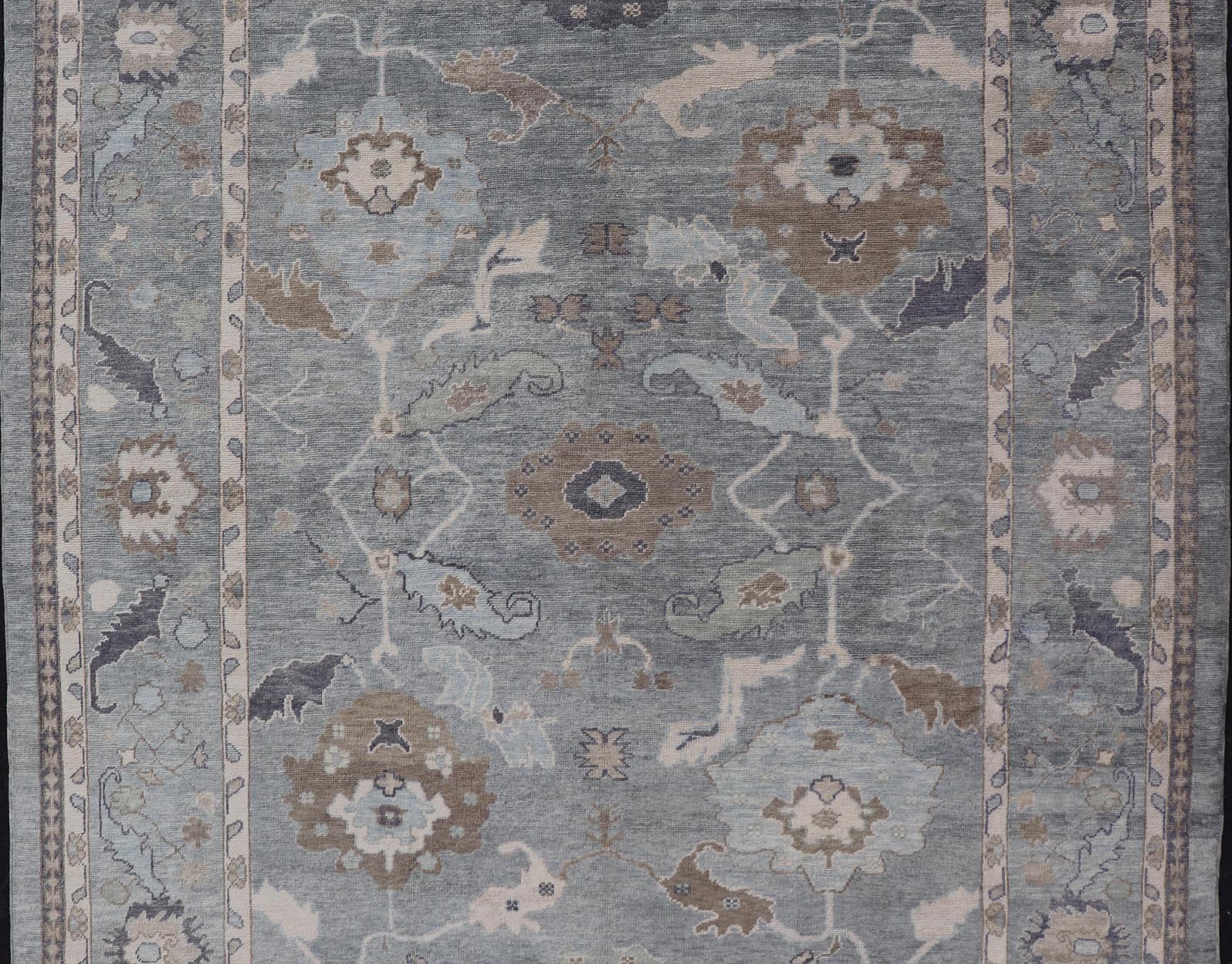 Measures: 10'7 x 14'7 Tribal Floral Design Hand Knotted Turkish Oushak Rug with Blues and Brown. rug EN - 15202, country of origin / type: Turkey / Oushak / Keivan Woven Arts This unique design Oushak rug from Turkey features a bold design wi... - Keivan Woven ArtsEN - 15202 - 22422Rug