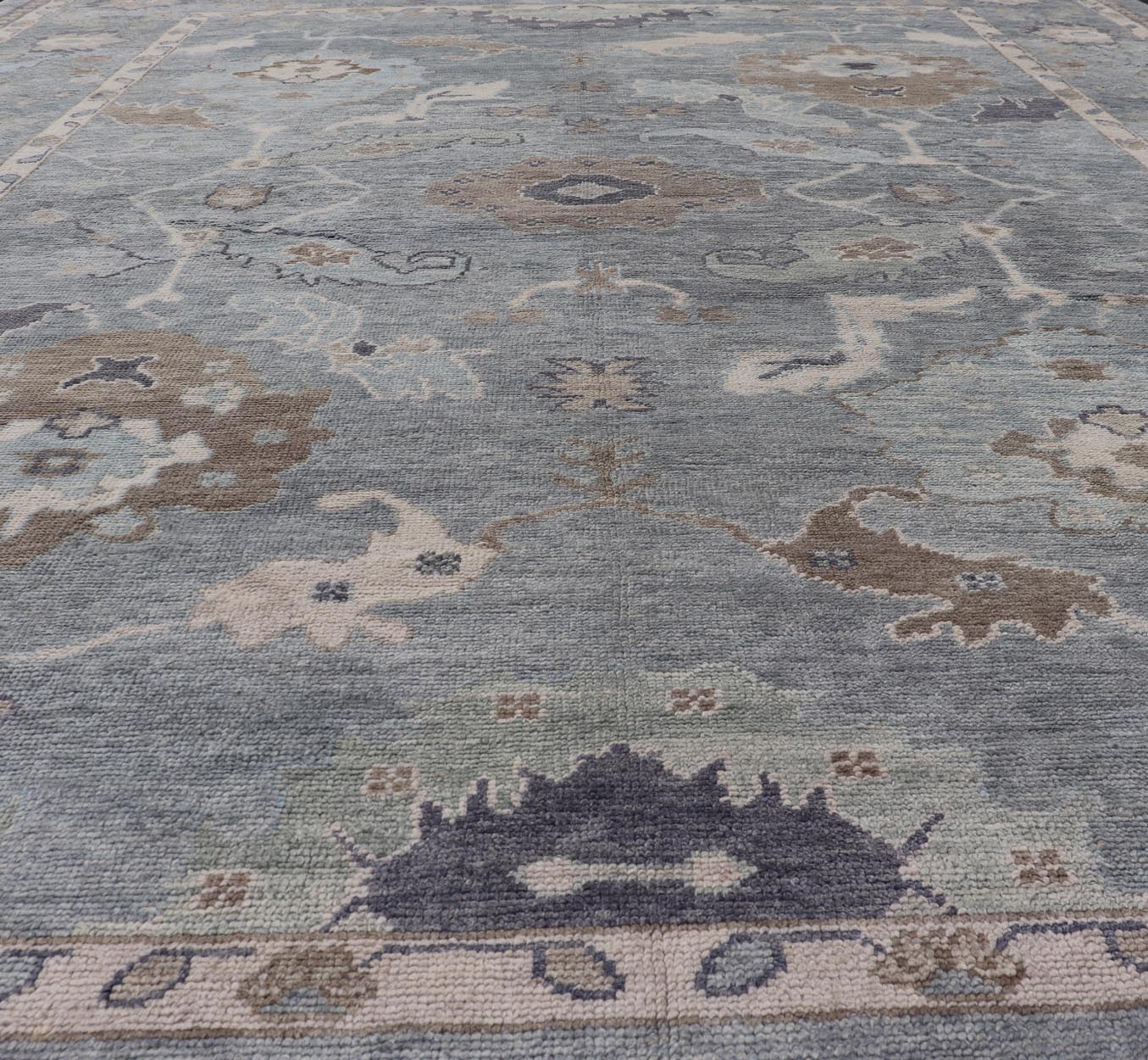 Measures: 10'7 x 14'7 Tribal Floral Design Hand Knotted Turkish Oushak Rug with Blues and Brown. rug EN - 15202, country of origin / type: Turkey / Oushak / Keivan Woven Arts This unique design Oushak rug from Turkey features a bold design wi... - Keivan Woven ArtsEN - 15202 - 22422Rug