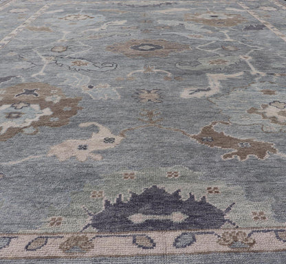 Measures: 10'7 x 14'7 Tribal Floral Design Hand Knotted Turkish Oushak Rug with Blues and Brown. rug EN - 15202, country of origin / type: Turkey / Oushak / Keivan Woven Arts This unique design Oushak rug from Turkey features a bold design wi... - Keivan Woven ArtsEN - 15202 - 22422Rug