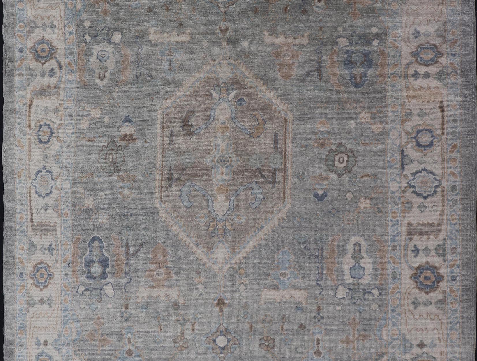 Measures: 7'3 x 10'4 Turkish Modern Oushak Rug in Medallion Design in Gray - Blue, and Marigold. Keivan Woven Arts / rug EN - 15208, country of origin / type: Turkey / Oushak This traditional Oushak rug from Turkey features a subdued, neutral co... - Keivan Woven ArtsEN - 15208 - 22416Rug