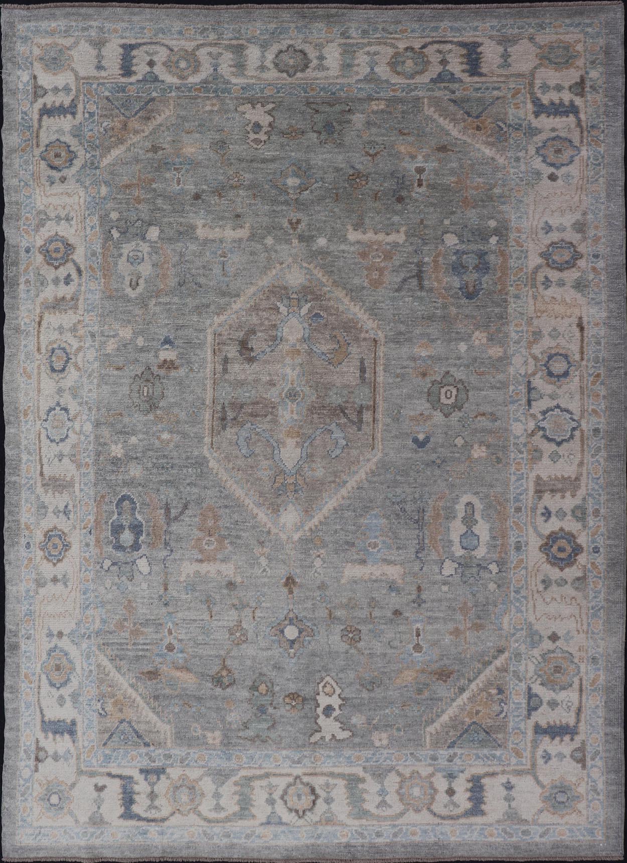 Measures: 7'3 x 10'4 Turkish Modern Oushak Rug in Medallion Design in Gray - Blue, and Marigold. Keivan Woven Arts / rug EN - 15208, country of origin / type: Turkey / Oushak This traditional Oushak rug from Turkey features a subdued, neutral co... - Keivan Woven ArtsEN - 15208 - 22416