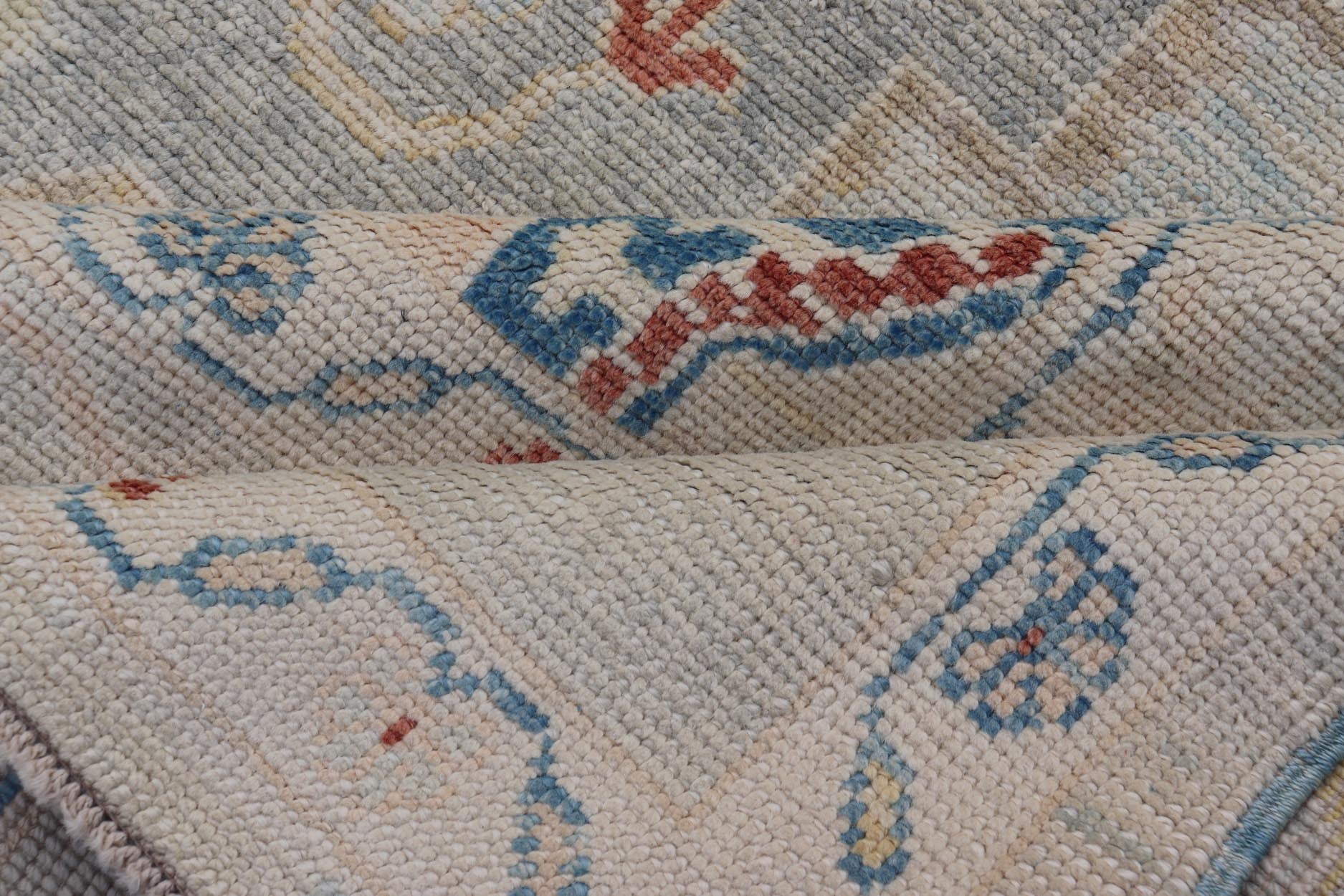 Measures: 8'5 x 11'9 Modern Oushak Turkish Rug with All Over Design in Light Blue, Ivory, & Red. Keivan Woven Arts / rug EN - 15209, country of origin / type: Turkey / Oushak. This Oushak in geometric design rug was woven in Turkey. Set on bea... - Keivan Woven ArtsEN - 15209 - 22434