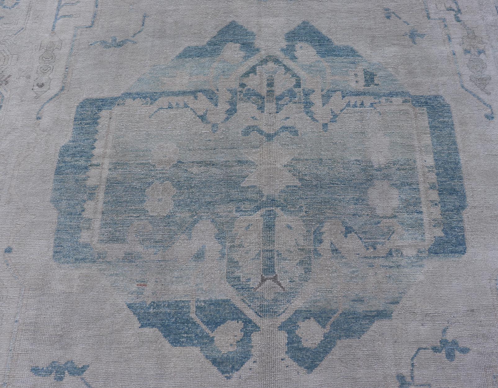 Measures: 10'0 x 13'3 Modern Turkish Oushak Large Medallion Rug in Light Blue and Cream. Keivan Woven Arts / rug EN - 15213, country of origin / type: Turkey / Oushak This traditional Oushak rug from Turkey features a subdued color palette and... - Keivan Woven ArtsEN - 15213 - 21901Rug