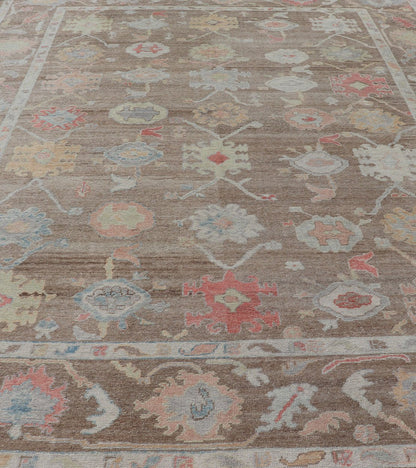 Measures: 12'0 x 15'0 Turkish Oushak Rug with All - Over Floral Design On A Light Brown Field. Keivan Woven Arts / rug EN - 15250, country of origin / type: Turkey / Oushak. This hand Knotted, hand spun wool Oushak rug from Turkey features a neu... - Keivan Woven ArtsEN - 15250 - 22884Rug