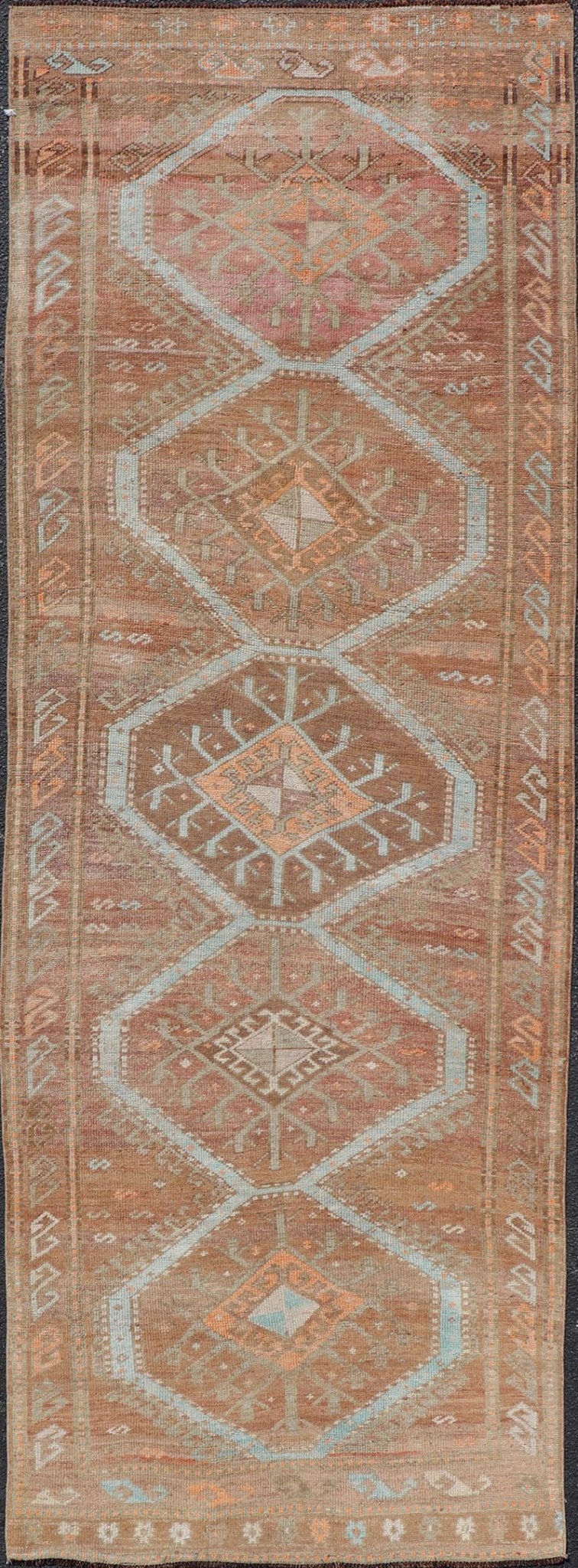 Colorful Turkish Kars Runner in Softer Tones with Tribal and Geometric Motifs. Keivan Woven Arts / rug/EN - 15341, country of origin / type: Turkey / Oushak, circa 1930 Measures: 3'9 x 10'9 This Unique & Colorful Turkish Kars runner featu... - Keivan Woven ArtsEN - 15341 - 23607Rug