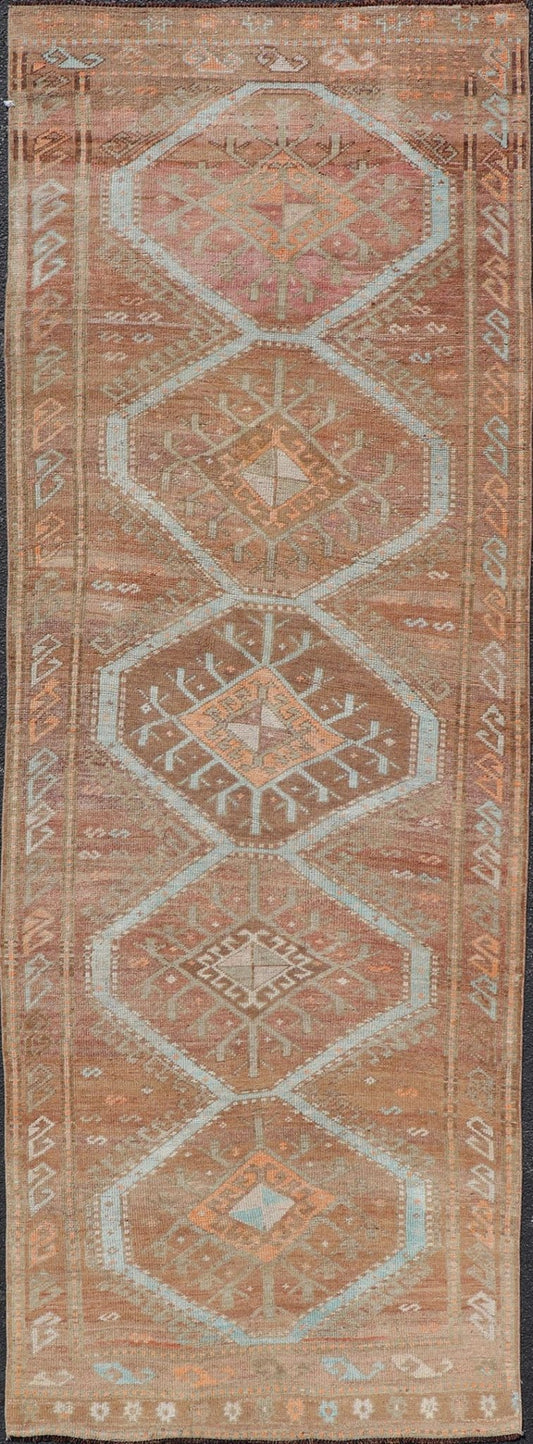Colorful Turkish Kars Runner in Softer Tones with Tribal and Geometric Motifs. Keivan Woven Arts / rug/EN - 15341, country of origin / type: Turkey / Oushak, circa 1930 Measures: 3'9 x 10'9 This Unique & Colorful Turkish Kars runner featu... - Keivan Woven ArtsEN - 15341 - 23607Rug