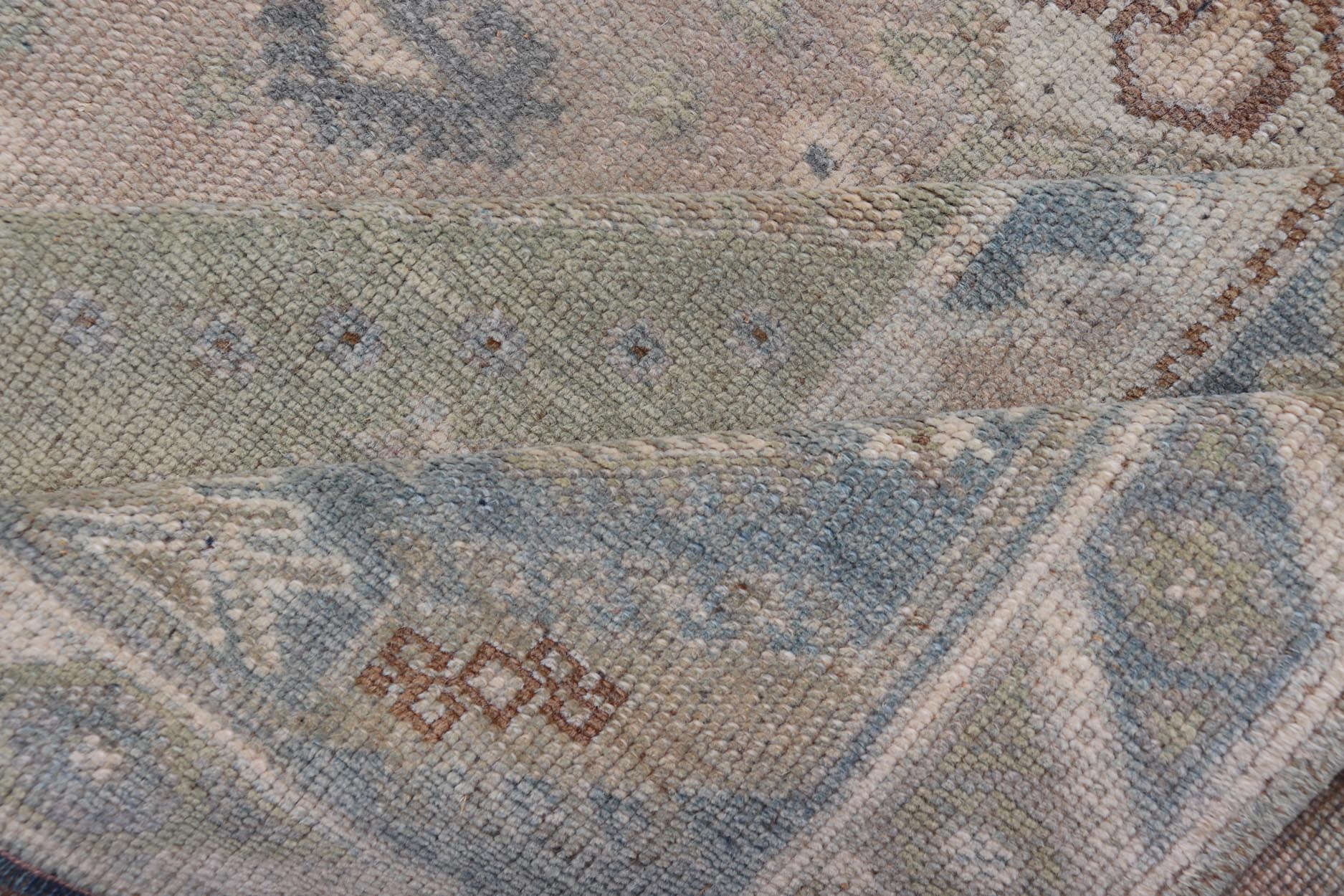 Vintage Turkish Rug with Unique Design in Blue, Taupe, Butter & Neutral Colors. Keivan Woven Arts / rug EN - 15376, country of origin / type: Turkey / Oushak, circa 1950 Measures: 4'6 x 6'6 This enchanting and unique vintage Oushak rug was made in... - Keivan Woven ArtsEN - 15376 - 23821Rug