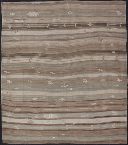 Vintage Kilim With Subtle Striped Patterns in Earth Tones Measures: 6'4" x 7'10" This Vintage Turkish Kilim showcases a flat weave with subtle patterns scattered across horizontal stripes. The kilim is decorated with shades of beige, bro... - Keivan Woven ArtsEN - 15524 - 25853Rug