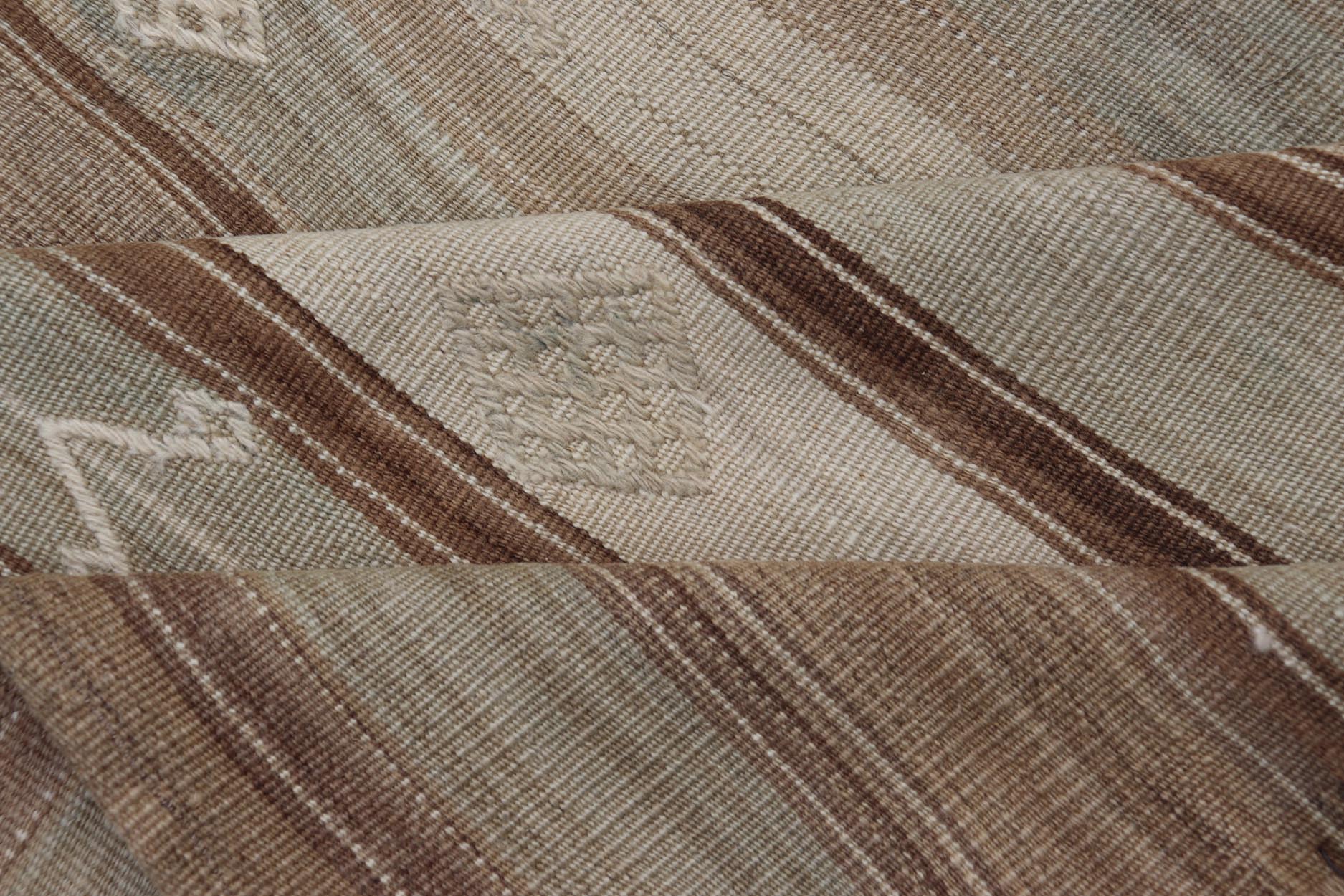 Vintage Kilim With Subtle Striped Patterns in Earth Tones Measures: 6'4" x 7'10" This Vintage Turkish Kilim showcases a flat weave with subtle patterns scattered across horizontal stripes. The kilim is decorated with shades of beige, bro... - Keivan Woven ArtsEN - 15524 - 25853Rug