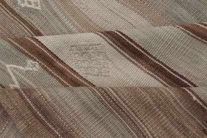 Vintage Kilim With Subtle Striped Patterns in Earth Tones Measures: 6'4" x 7'10" This Vintage Turkish Kilim showcases a flat weave with subtle patterns scattered across horizontal stripes. The kilim is decorated with shades of beige, bro... - Keivan Woven ArtsEN - 15524 - 25853Rug