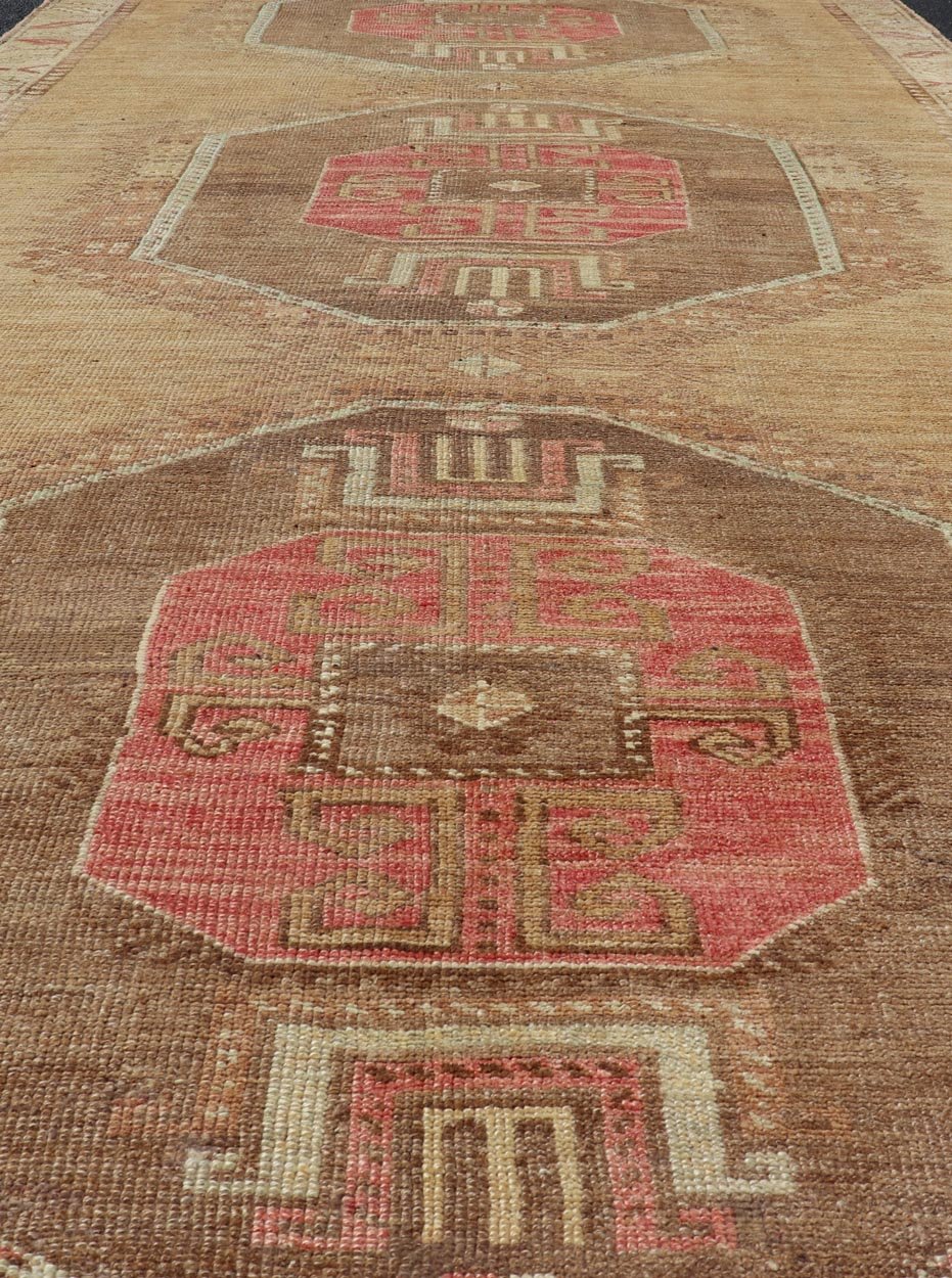 Vintage Turkish Kars wide Gallery Rug With Geometric Medallions by Keivan Woven Arts This Gallery Kars rug showcases three large, octagonal medallions aligned vertically along the length of the Turkish Kars runner. This wide gallery runner is ... - Keivan Woven ArtsEN - 15537 - 26544Rug