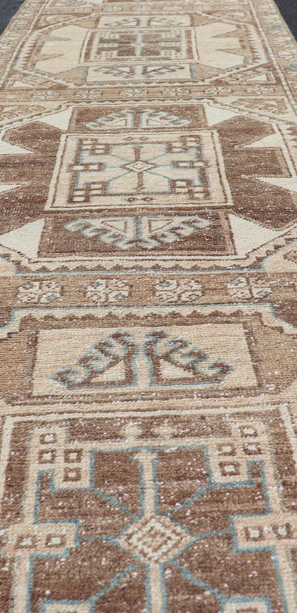 Vintage Runner with large octagonal medallions by Keivan Woven Arts Measures: 2'11" x 10' This exquisite vintage Turkish runner features a trio of large, octagonal medallions placed along the length of the vintage runner. The medallions a... - Keivan Woven ArtsEN - 15870 - 26904Rug