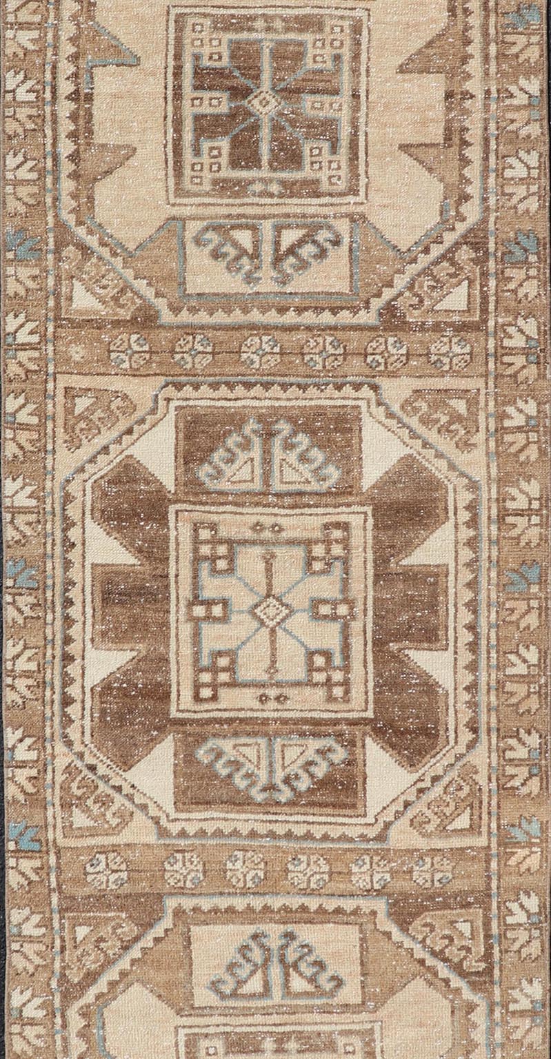 Vintage Runner with large octagonal medallions by Keivan Woven Arts Measures: 2'11" x 10' This exquisite vintage Turkish runner features a trio of large, octagonal medallions placed along the length of the vintage runner. The medallions a... - Keivan Woven ArtsEN - 15870 - 26904Rug