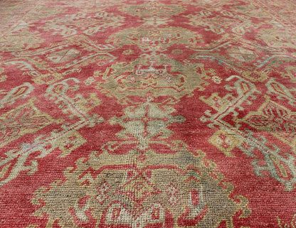 Rose red, light green and pinkish red antique Turkish Oushak rug with flowing design. Keivan Woven Arts / rug EN - 165065, country of origin type: Turkey Oushak, circa 1920. Measures: 11' x 13'7. This Oushak carpet (circa early 20th century) featur... - Keivan Woven ArtsEN - 165065 - 9420Rug