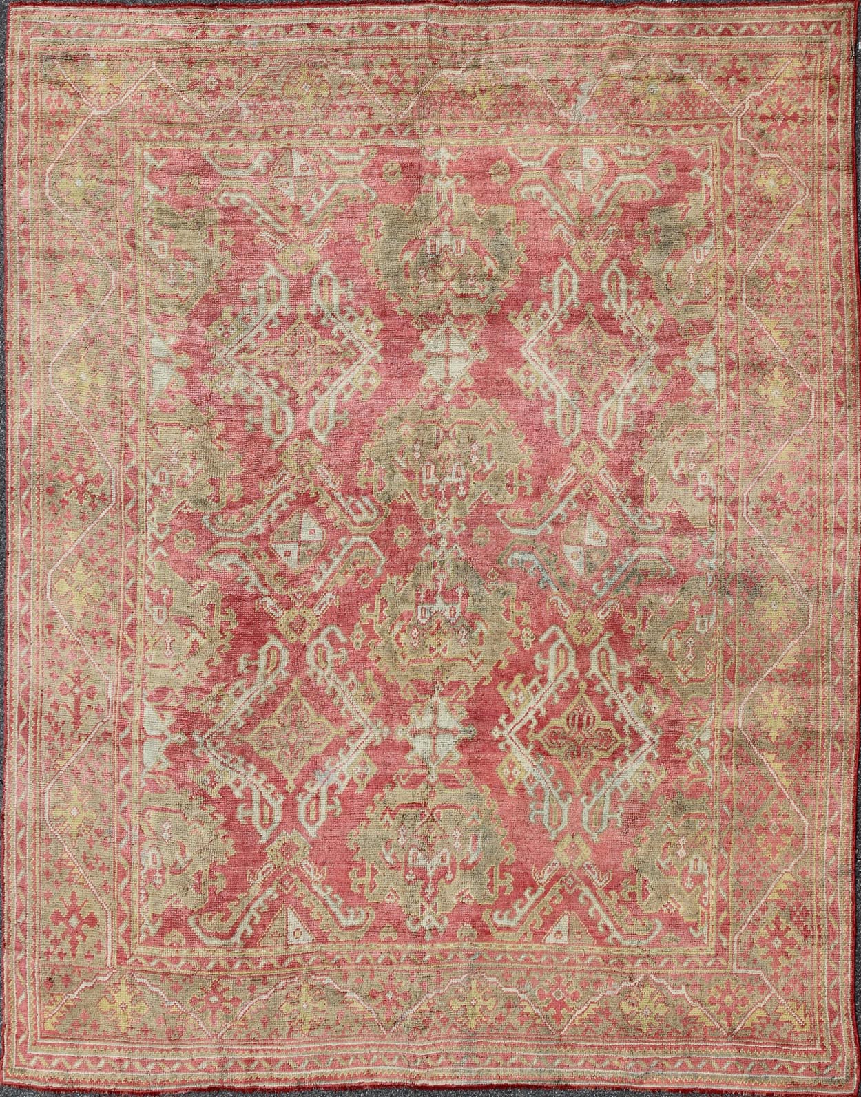 Rose red, light green and pinkish red antique Turkish Oushak rug with flowing design. Keivan Woven Arts / rug EN - 165065, country of origin type: Turkey Oushak, circa 1920. Measures: 11' x 13'7. This Oushak carpet (circa early 20th century) featur... - Keivan Woven ArtsEN - 165065 - 9420Rug