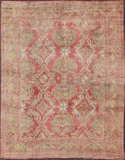 Rose red, light green and pinkish red antique Turkish Oushak rug with flowing design. Keivan Woven Arts / rug EN - 165065, country of origin type: Turkey Oushak, circa 1920. Measures: 11' x 13'7. This Oushak carpet (circa early 20th century) featur... - Keivan Woven ArtsEN - 165065 - 9420Rug