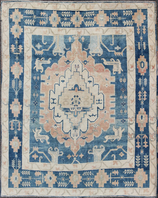 Blue and Salmon Vintage Turkish Oushak Rug with Layered Medallion and Motifs. Keivan Woven Arts / rug / EN - 165189, country of origin / type: Turkey / Oushak, Mid - 20th century. Measures: 9'11 x 11'8. This beautiful vintage rug from mid - 20th centu... - Keivan Woven ArtsEN - 165189 - 9016