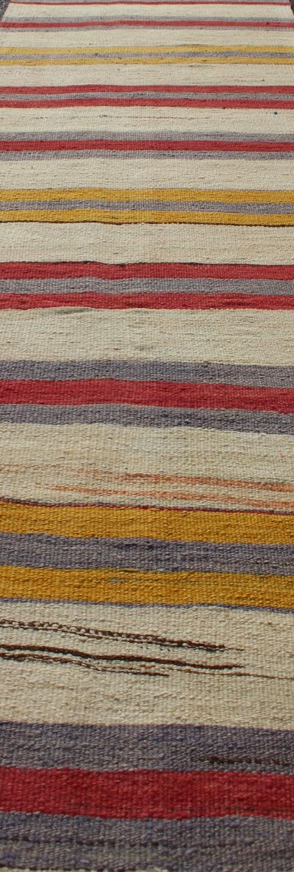 Yellow, red, ivory, and gray stripe design flat - weave vintage runner from Turkey, rug en - 165311, country of origin / type: Iran / Kilim, circa 1950. Featuring a dynamic stripe design, this unique 1950s Kilim runner showcases an array of vibrant ... - Keivan Woven ArtsEN - 165311 - 10950Rug