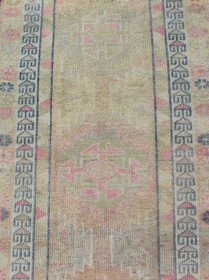 Oushak runner with tribal motifs in blue and pink, rug EN - 165353, country of origin / type: Turkey / Oushak, circa 1960 This Oushak runner from Turkey is characterized by a neutral - toned background and an assortment of tribal designs and flowers... - Keivan Woven ArtsEN - 165353 - 11421Rug