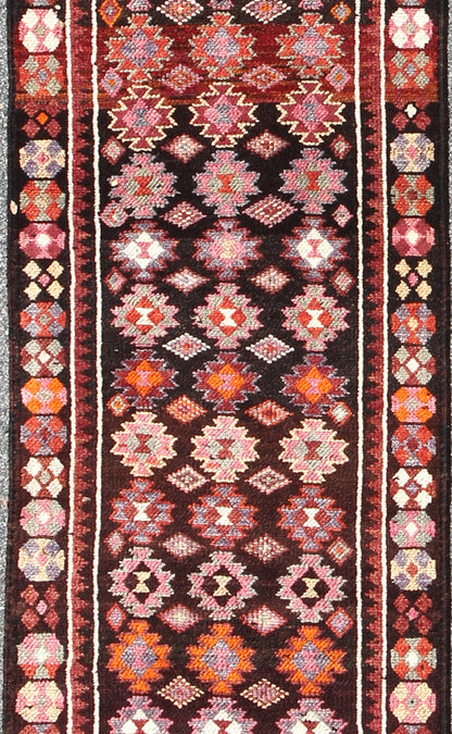 Black and Brown Background Colorful Vintage Turkish Runner with Geometric Design, rug en - 165383, country of origin / type: Turkey / Oushak, circa 1950 This vintage Turkish runner (circa mid - 20th century) features a unique blend of colors and an ... - Keivan Woven ArtsEN - 165383 - 9026Rug