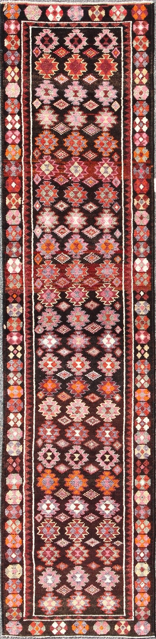 Black and Brown Background Colorful Vintage Turkish Runner with Geometric Design, rug en - 165383, country of origin / type: Turkey / Oushak, circa 1950 This vintage Turkish runner (circa mid - 20th century) features a unique blend of colors and an ... - Keivan Woven ArtsEN - 165383 - 9026Rug