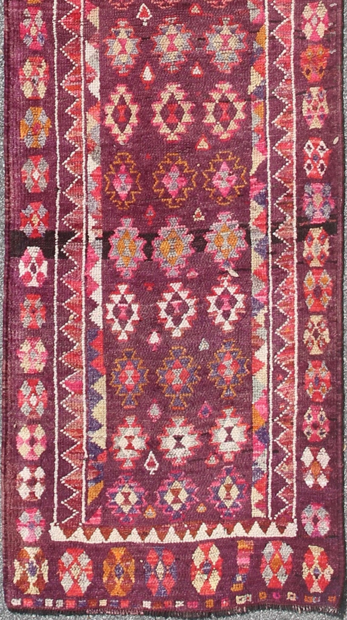 Colorful vintage Turkish Long Oushak runner with geometric design in Purple & Plum background , rug en - 165655, country of origin / type: Turkey / Oushak, circa 1950 This vintage Oushak runner (circa mid - 20th century) features a unique blend of c... - Keivan Woven ArtsEN - 165655 - 9056Rug