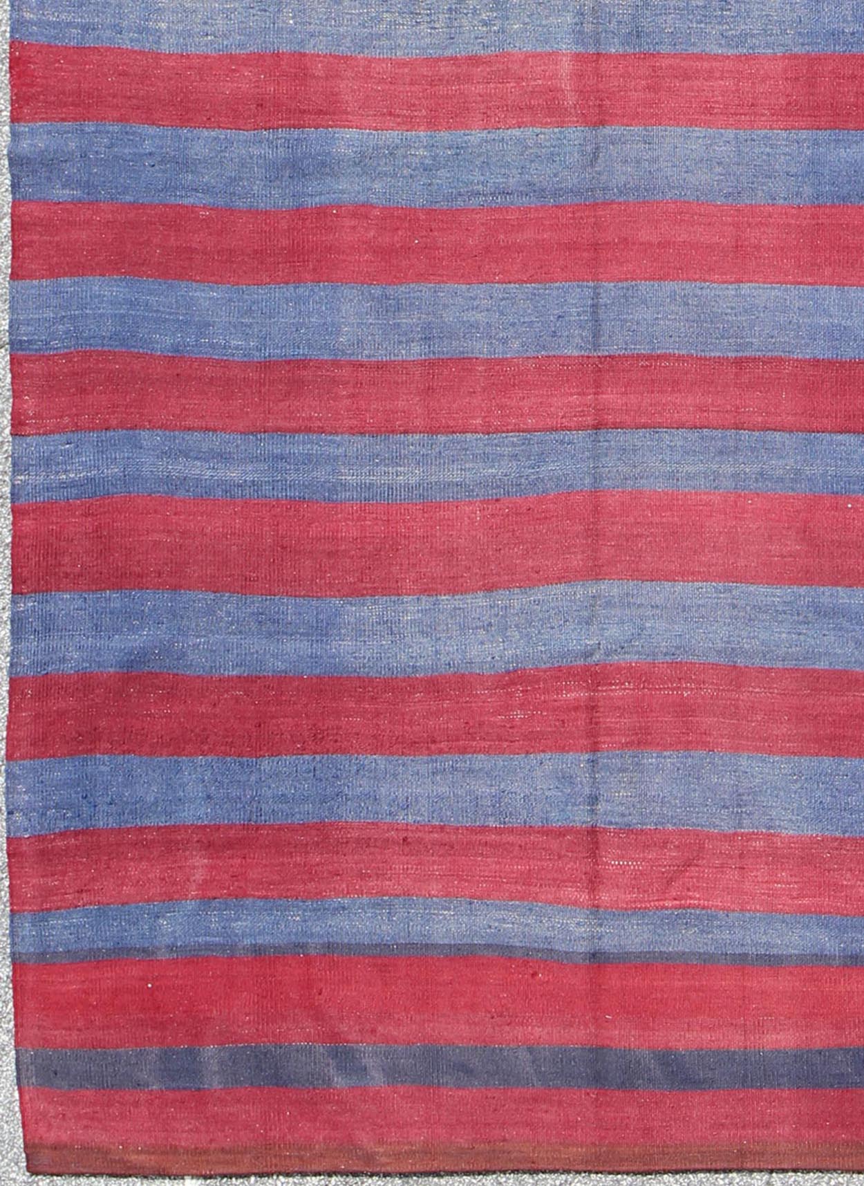 Vintage Striped Turkish Kilim with Casual Modern Design in Red and Blue Red and blue Vintage striped Turkish Kilim suited for modern casual interiors. Kilim rug with stripes, Keivan Woven Arts / rug/ EN - 165696, country of origin / type: turkey /... - Keivan Woven ArtsEN - 165696 - 9480Rug