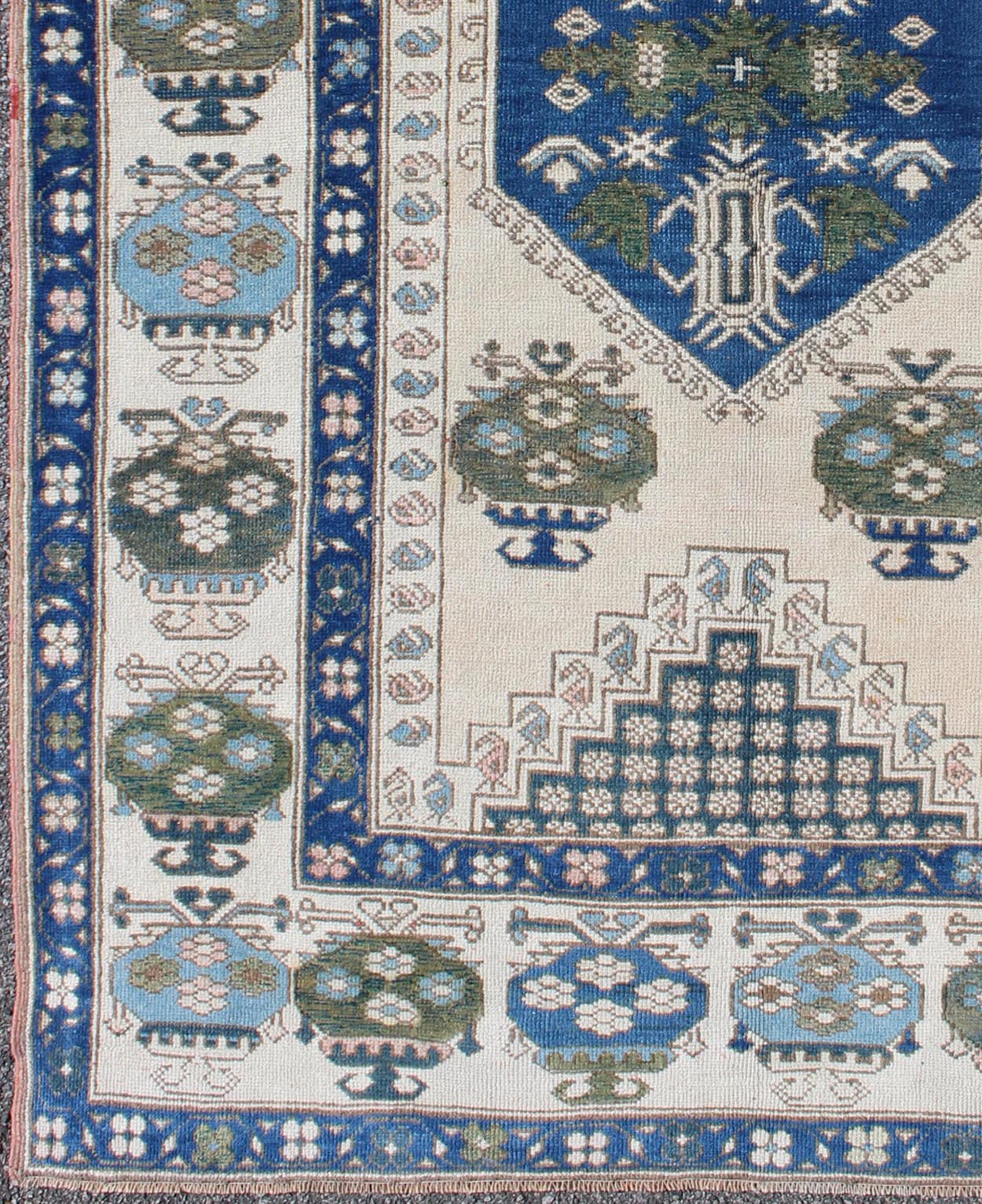 Blue and Green Geometric Oushak Vintage Rug with Medallion. Vintage Oushak carpet in geometric design with variety of blue colors, green, taupe, tan and ivory. rug/EN - 165827, country of origin / type: Turkey / Oushak, circa 1950 This ... - Keivan Woven ArtsEN - 165827 - 9500Rug