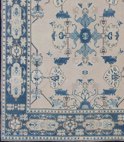 Oushak Rug from Mid - 20th Century Turkey with Blue and Cream Tribal Design Vintage Turkish Oushak in Cream and Blue, rug en - 165875, country of origin / type: Turkey / Oushak, circa 1940 This tribal design Oushak carpet features an array of... - Keivan Woven ArtsEN - 165875 - 11249Rug