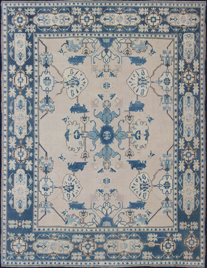 Oushak Rug from Mid - 20th Century Turkey with Blue and Cream Tribal Design Vintage Turkish Oushak in Cream and Blue, rug en - 165875, country of origin / type: Turkey / Oushak, circa 1940 This tribal design Oushak carpet features an array of... - Keivan Woven ArtsEN - 165875 - 11249Rug