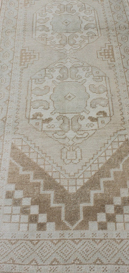Subdued Vintage Turkish Oushak Runner with Medallions Lightly toned vintage Turkish Runner with Oushak design, Keivan Woven Arts / rug EN - 176032, country of origin / type: Turkey / Oushak, circa 1940. This vintage Turkish Oushak runner fe... - Keivan Woven ArtsEN - 176032 - 10233Rug
