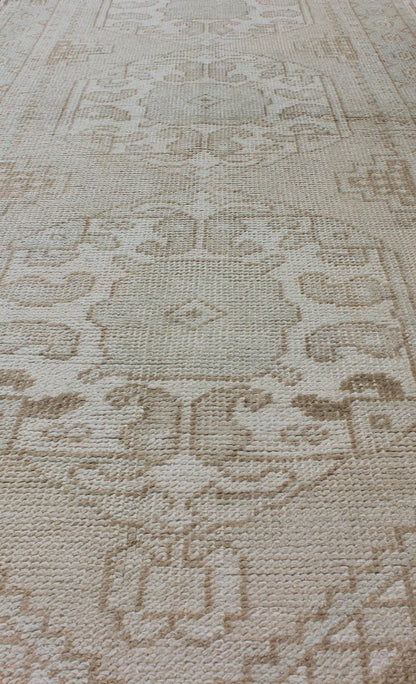 Subdued Vintage Turkish Oushak Runner with Medallions Lightly toned vintage Turkish Runner with Oushak design, Keivan Woven Arts / rug EN - 176032, country of origin / type: Turkey / Oushak, circa 1940. This vintage Turkish Oushak runner fe... - Keivan Woven ArtsEN - 176032 - 10233Rug