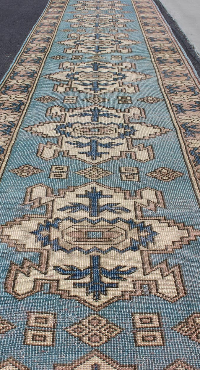 Long Vintage Turkish Runner with Geometric Design in Light Blue and Taupe kwarugs Long vintage Turkish runner with geometric design in light blue and taupe Vintage Oushak runner from Turkey with Medallion design in various color tones, rug e... - Keivan Woven ArtsEN - 176085 - 11437Rug