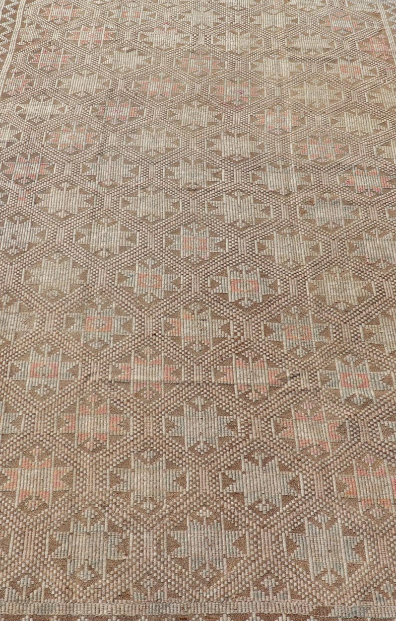 Measures: 5'2 x 9'3 Vintage Turkish Embroidered Kilim with All - Over Star Design on A Taupe Ground. Keivan Woven Arts / rug EN - 176232, country of origin / type: Turkey / Kilim, circa 1950 This vintage Kilim displays an array of designs, including... - Keivan Woven ArtsEN - 176232 - 21907Rug